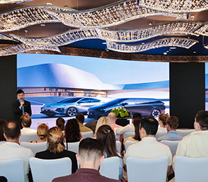 Students attending a lecture during a company or site visit in China.
