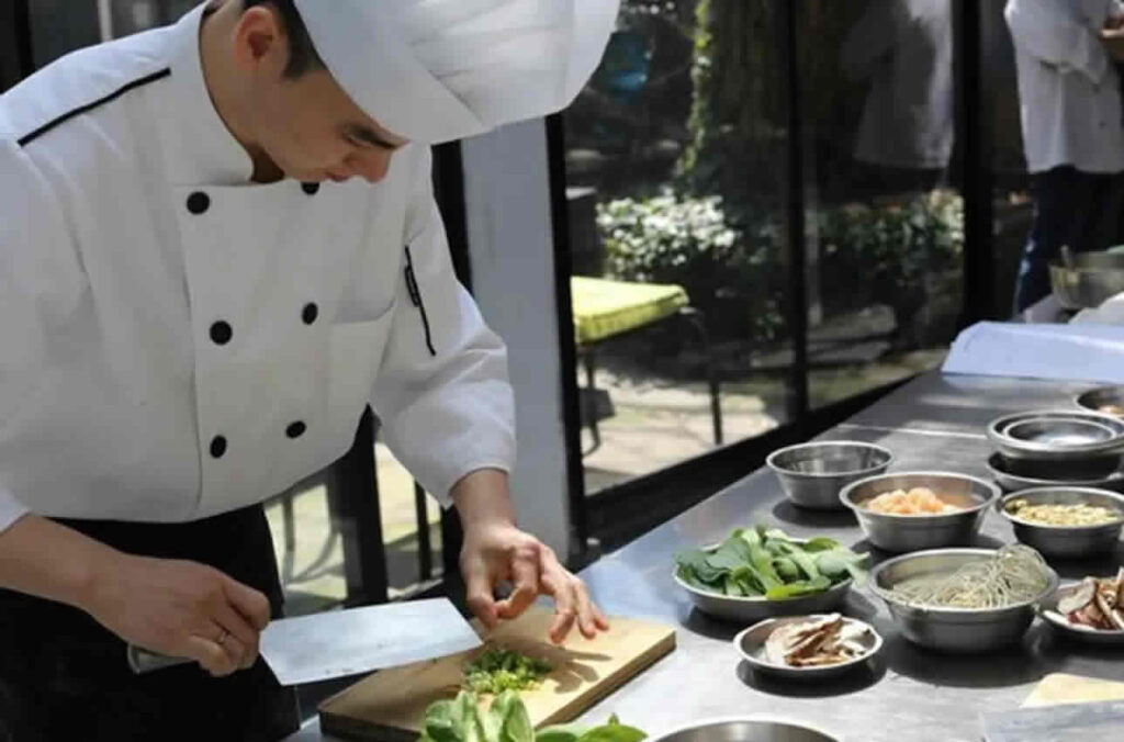 Students making traditional Chinese dumplings during a cultural experience in Hexi Village