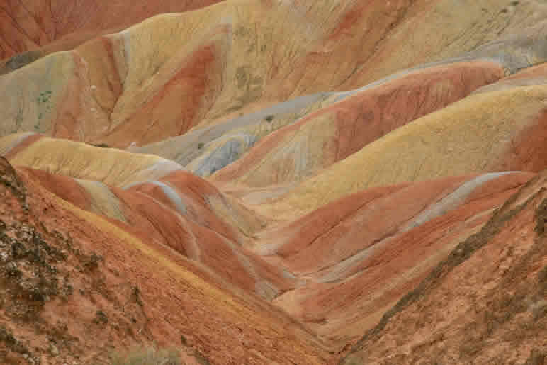 Students exploring geology and science on a STEAM educational tour at Zhangye Danxia Landform, China