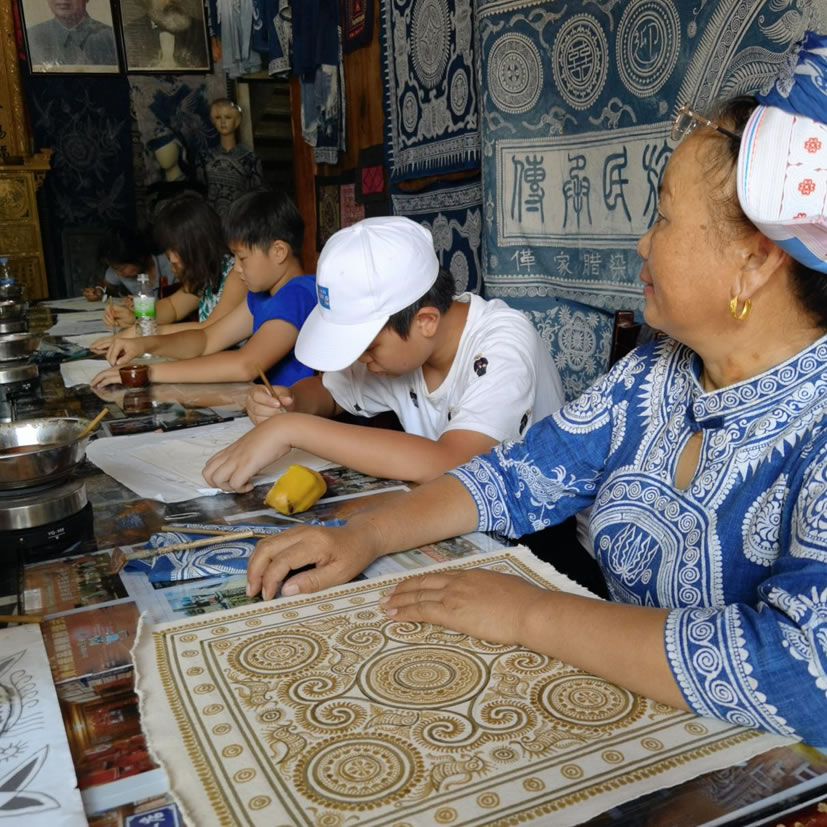 Learning Miao embroidery and silverwork on a cultural heritage school trip to rural China