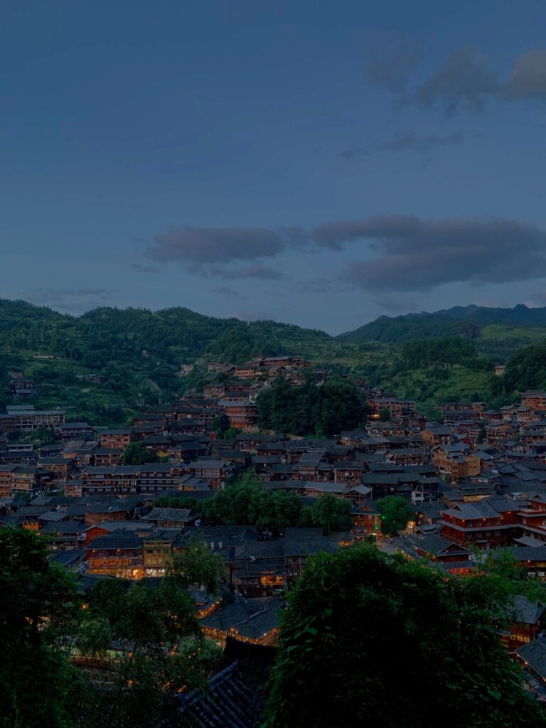 Students on a service learning school trip in Guizhou, China, engaging in community projects, farm work, cultural exchange, and homestay experiences with local Miao villagers
