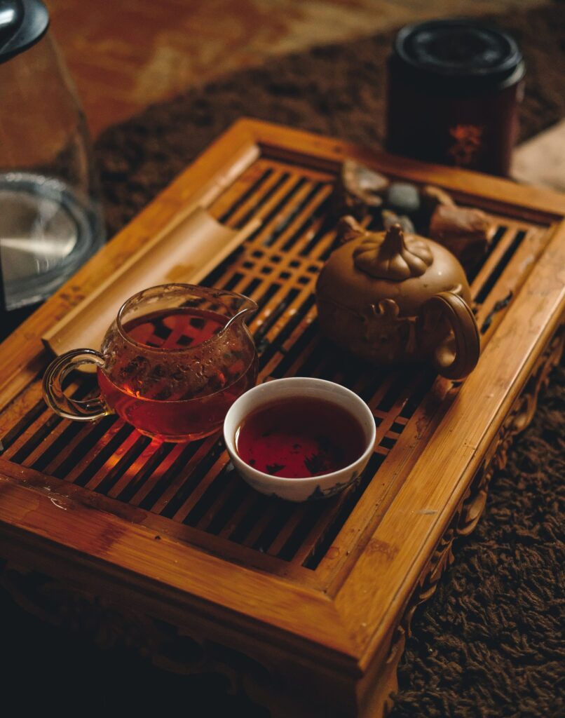 Students participating in traditional tea harvesting during a school trip to China, learning about local agriculture and cultural practices