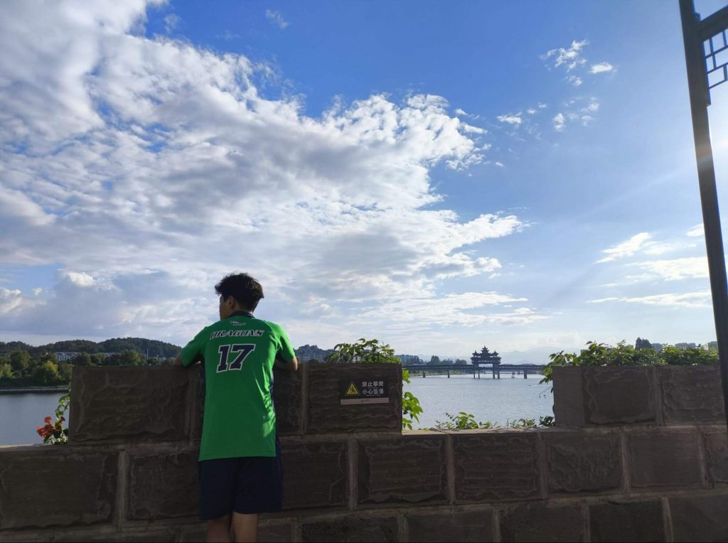 Student reflecting and enjoying a panoramic view