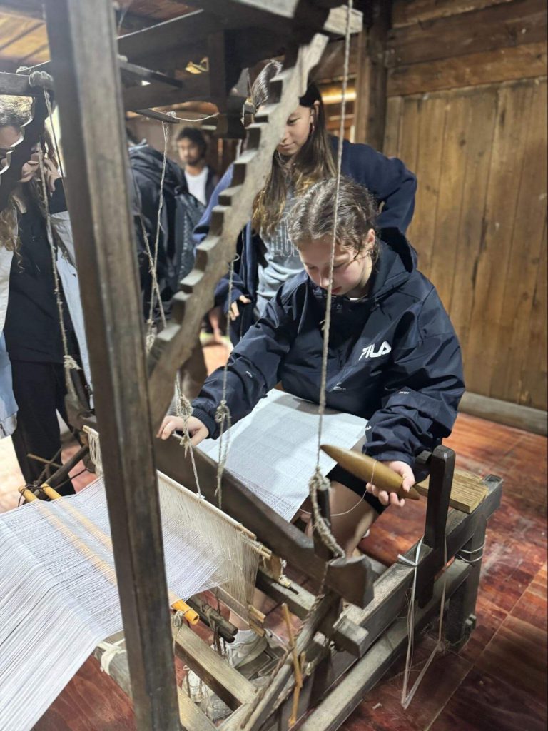 Students participating in a traditional craft workshop in rural China.