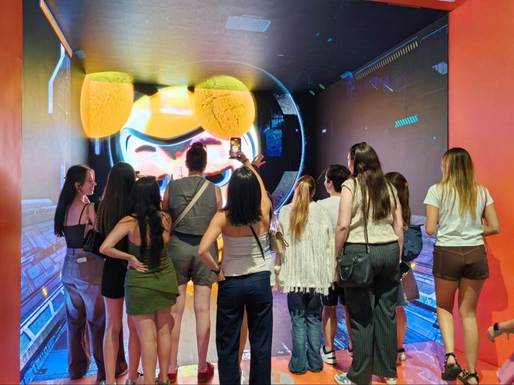 Students experiencing technology and innovation in a modern Chinese city.