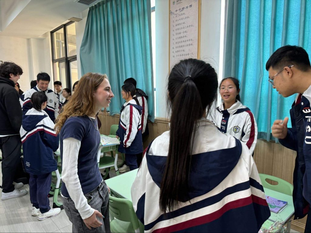 Students taking part in a community immersion activity during a school trip in Southwest China.