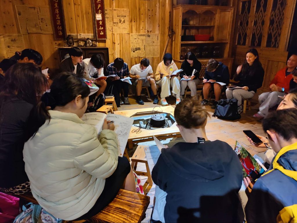 Students making notes and reflecting on trip activities