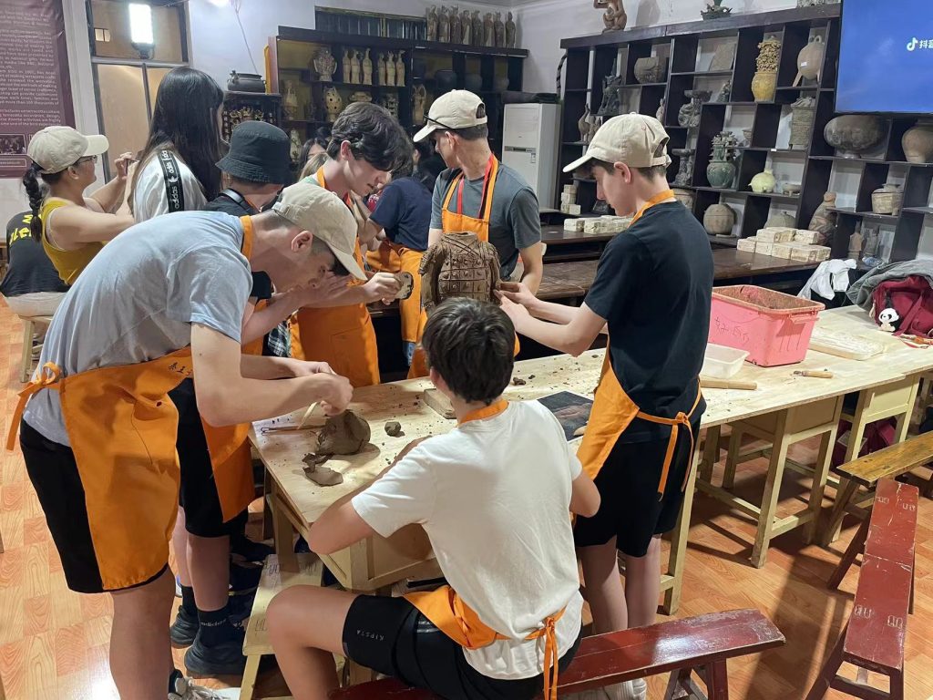 Students taking part in a traditional craft workshop during a school trip to Xi'an.